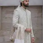 Pistachio sherwani with handmade embroidery and designer metal buttons