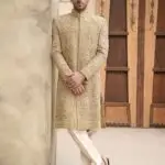 Golden jamawar sherwani for groom with heavy embroidery