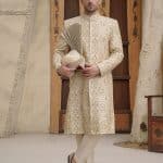 Off white embroidered sherwani for groom with hidden buttons