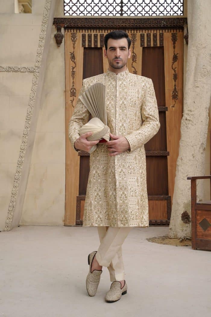 Off white embroidered sherwani for groom with hidden buttons Off white embroidered sherwani for groom with hidden buttons