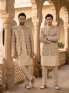 Step into timeless elegance with this premium Prince Coat crafted from luxurious silk-based fabric and enhanced with intricate digital thread embroidery.