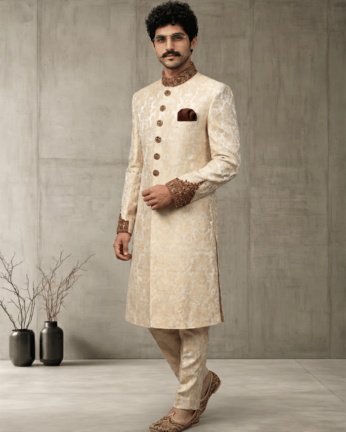 Elevate your wedding and festive look with this Luxury IvoryJamawar Sherwani, crafted from premium Jamawar fabric featuring an elegant woven pattern.