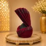 Complete your royal wedding look with this Luxury Maroon Velvet Groom Turban, expertly handcrafted from premium velvet fabric and adorned with elegant black bead embellishments.