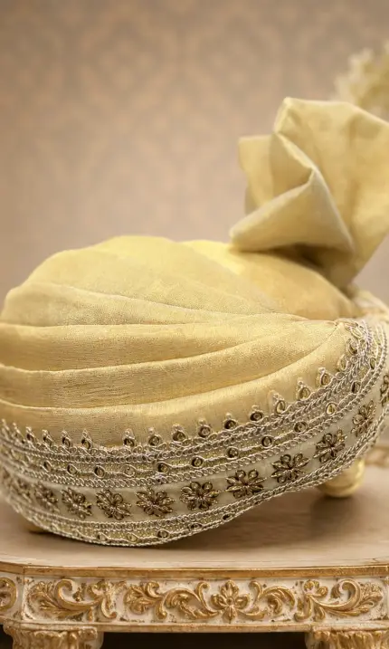 Elevate your wedding look with this elegant royal golden turban, crafted to add a touch of sophistication and grandeur.