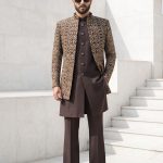 Make a lasting impression with our Luxury Brown Jacquard Short Sherwani Three Piece Suit. Featuring an intricately woven jacquard short sherwani