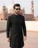 Velvet Sherwani in black fabric with handmade embroidery for men’s luxury wedding wear.