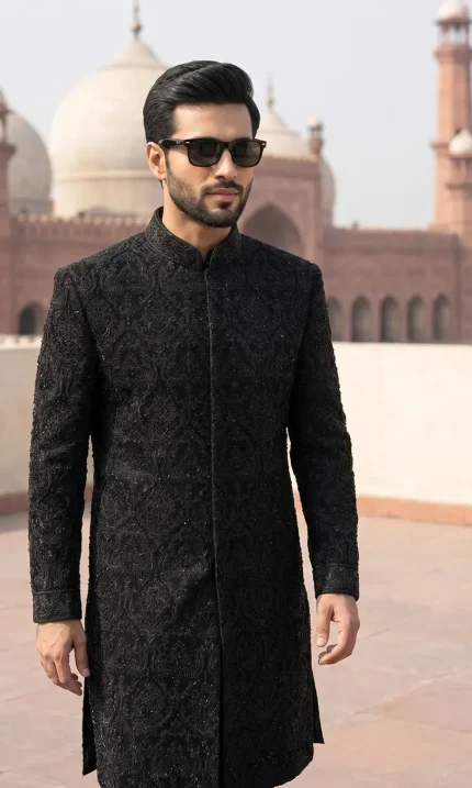 Velvet Sherwani in black fabric with handmade embroidery for men’s luxury wedding wear.