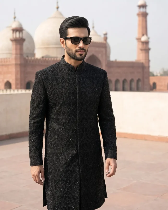 Velvet Sherwani in black fabric with handmade embroidery for men’s luxury wedding wear.