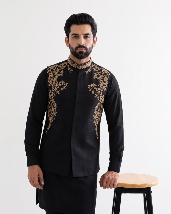 Black tropical fabric handmade embroidered men's waistcoat with elegant gold floral embroidery, mandarin collar, premium ethnic formal wear for weddings and festive occasions."